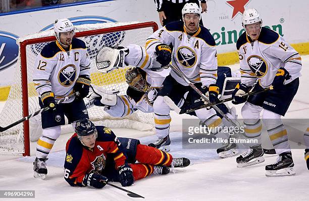 Linus Ullmark of the Buffalo Sabres dives in front of the net as Jussi Jokinen of the Florida Panthers looks on during a game at BB&T Center on...