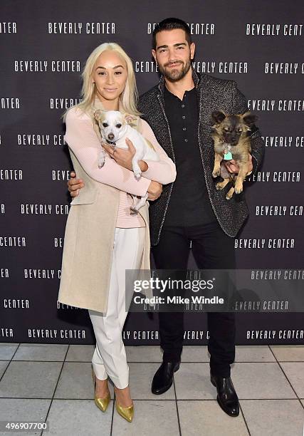 Hollywood couple Jesse Metcalfe, Cara Santana and their pups Shepherd and Dexter pose for the first 'Pet Portrait with Santa' of the season at the...