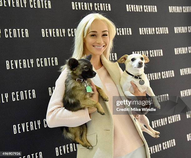 Hollywood couple Jesse Metcalfe, Cara Santana and their pups Shepherd and Dexter pose for the first 'Pet Portrait with Santa' of the season at the...