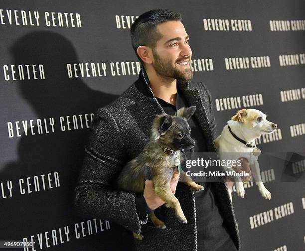 Hollywood couple Jesse Metcalfe, Cara Santana and their pups Shepherd and Dexter pose for the first 'Pet Portrait with Santa' of the season at the...