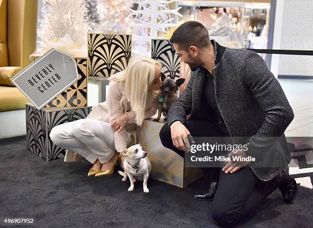 Hollywood couple Jesse Metcalfe, Cara Santana and their pups Shepherd and Dexter pose for the first 'Pet Portrait with Santa' of the season at the...