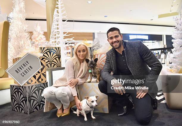 Hollywood couple Jesse Metcalfe, Cara Santana and their pups Shepherd and Dexter pose for the first 'Pet Portrait with Santa' of the season at the...