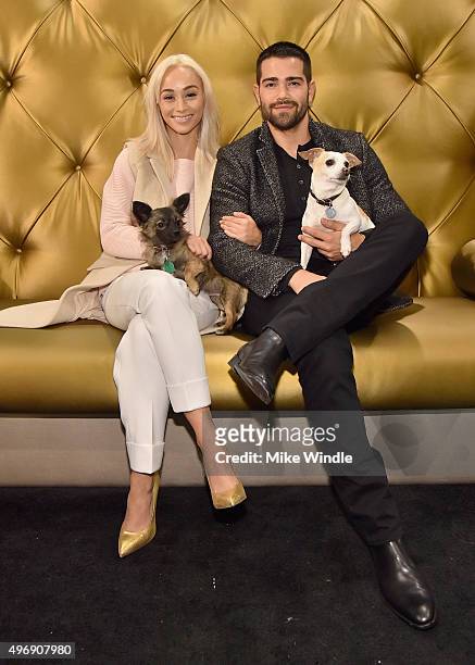 Hollywood couple Jesse Metcalfe, Cara Santana and their pups Shepherd and Dexter pose for the first 'Pet Portrait with Santa' of the season at the...