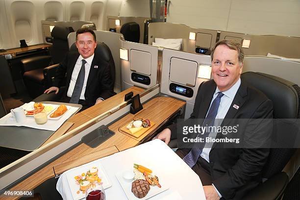 Alan Joyce, chief executive officer of Qantas Airways Ltd., left, and William Douglas "Doug" Parker, chairman and chief executive officer of American...