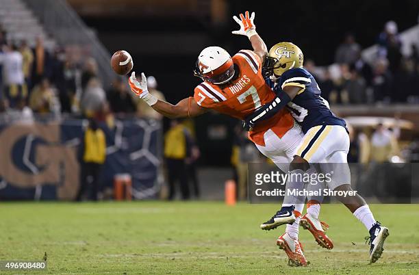 Defensive back Lawrence Austin of the Georgia Tech Yellow Jackets breaks up a pass intended for tight end Bucky Hodges of the Virginia Tech Hokies in...