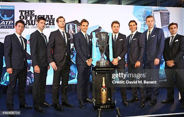 Kei Nishikori, Novak Djokovic, Andy Murray, Roger Federer, Stan Wawrinka, Rafael Nadal, Tomas Berdych and David Ferrer celebrate with Moet & Chandon...