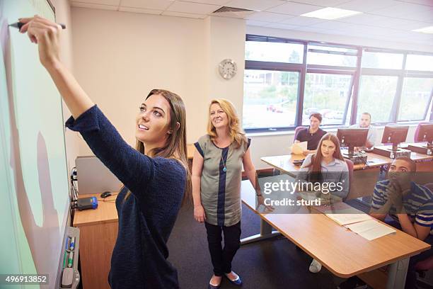 university student presenting to class - digital board stock pictures, royalty-free photos & images