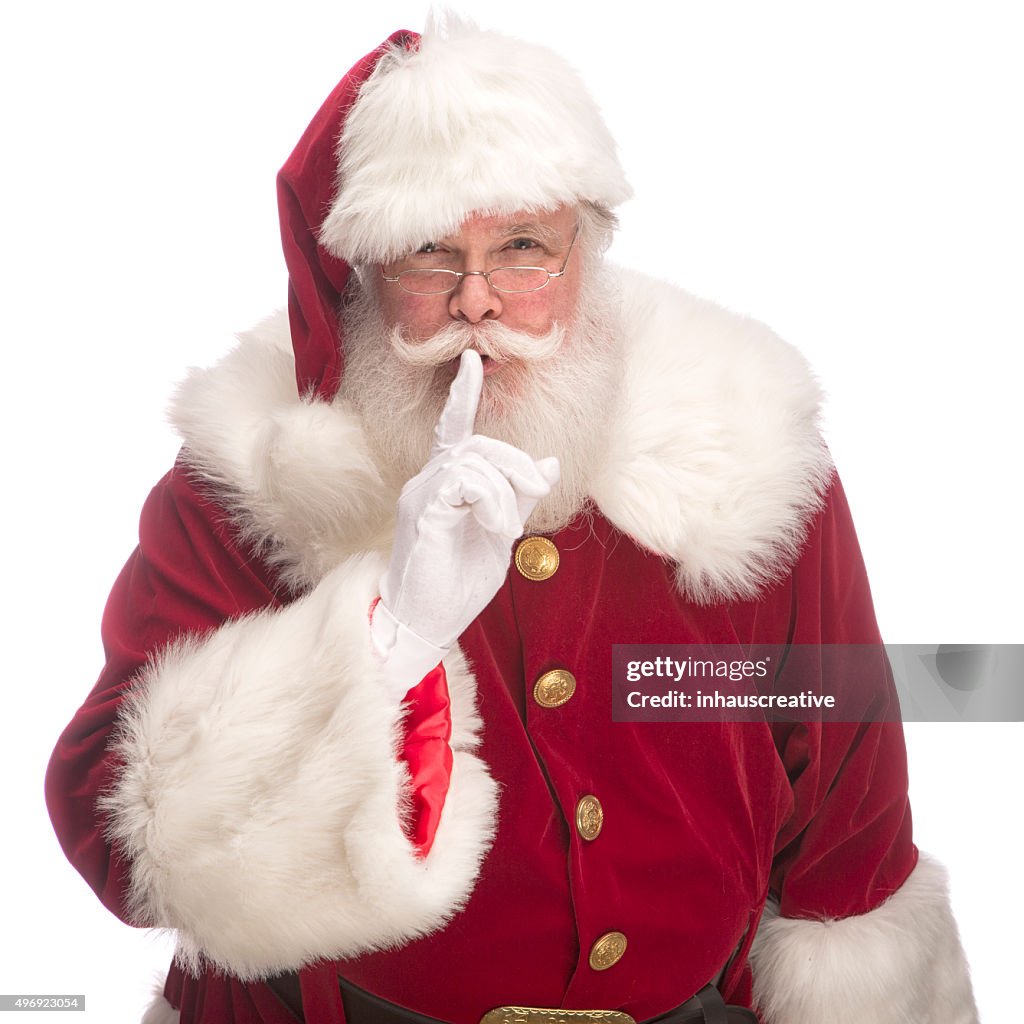 Portrait of the Real Santa Claus with fingers on lips