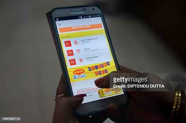 In this photograph taken on November 12 an Indian woman registers on the e-commerce website Snapdeal for the Maggi Noodles 'Welcome Kit', in...