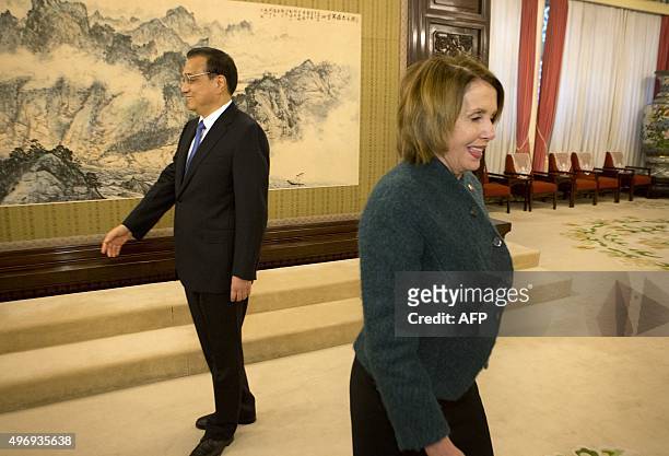 House Minority Leader Nancy Pelosi of California arrives for a bilateral meeting as Chinese Premier Li Keqiang waits to greet other guests at the...