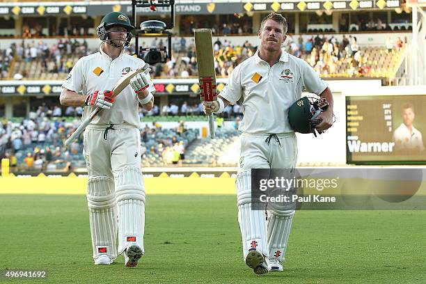 Steven Smith and David Warner of Australia walk from the field at the end of play during day one of the second Test match between Australia and New...