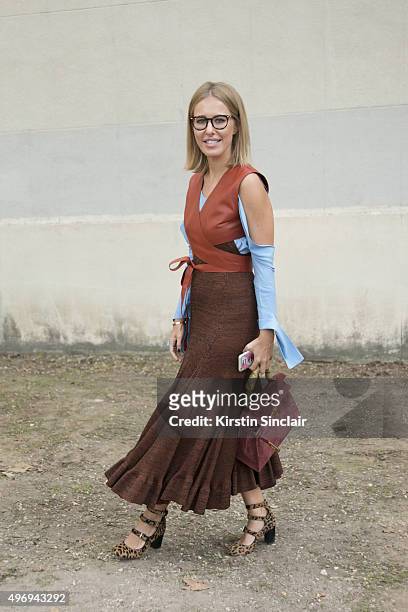 Russian Journalist for L'Officiel Ksenia Sobchak wears a Celine dress, Tabitha Simmons shoes and a Hermes bag on day 6 during Paris Fashion Week...