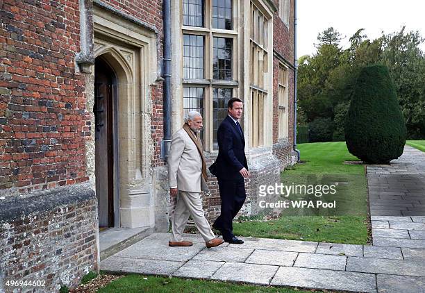 Prime Minister David Cameron walks in the garden at Chequers in Buckinghamshire with his Indian counter-part Narendra Modi on the second day of an...
