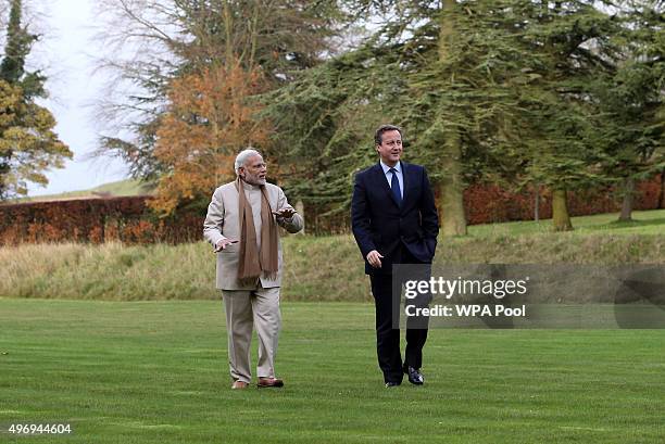 Prime Minister David Cameron walks in the garden at Chequers in Buckinghamshire with his Indian counter-part Narendra Modi on the second day of an...