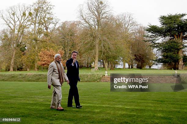 Prime Minister David Cameron walks in the garden at Chequers in Buckinghamshire with his Indian counter-part Narendra Modi on the second day of an...