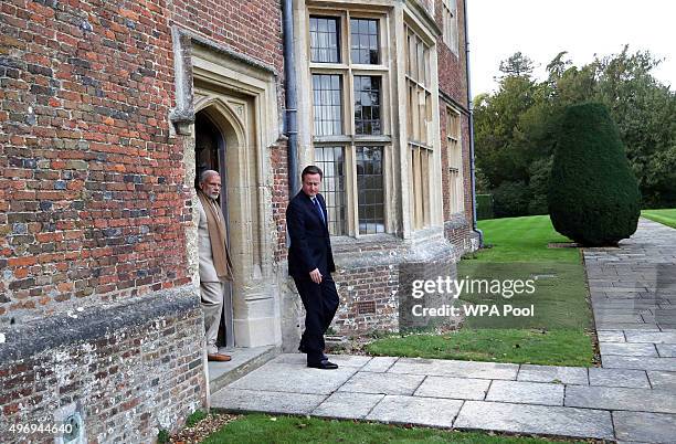 Prime Minister David Cameron walks in the garden at Chequers in Buckinghamshire with his Indian counter-part Narendra Modi on the second day of an...