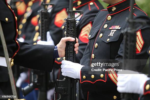 Honor guard members prepare rifles to fire salute. Veteran's Day in New York City was marked by the traditional wreath-laying ceremony in Madison...