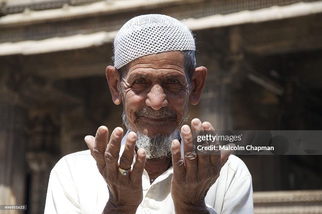Praying man, Ahmedabad, India - Editorial image