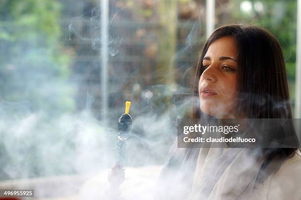 playing with smoke - hookah stock pictures, royalty-free photos & images