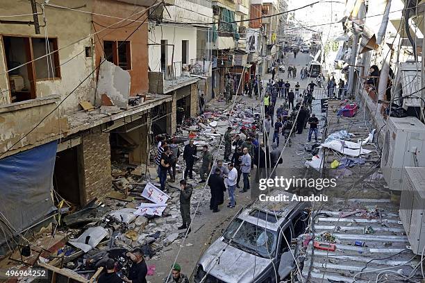 Lebanese people inspect an area where two explosions took place at Dahieh, know as Hezbollah stronghold, South Beirut, Lebanon on November 13, 2015....