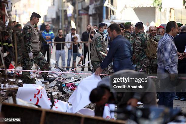 Lebanese soldiers inspect an area where two explosions took place at Dahieh, know as Hezbollah stronghold, South Beirut, Lebanon on November 13,...