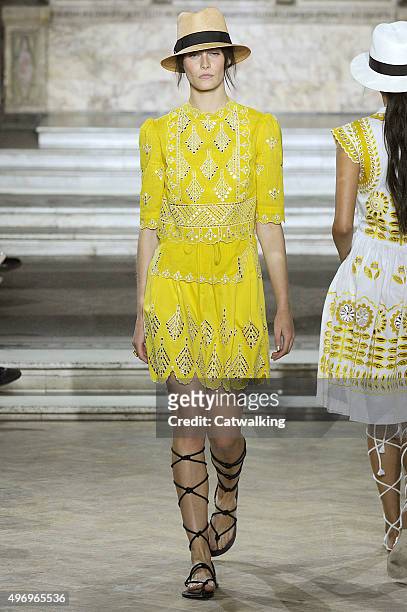 Wearing the latest yellow color trend, a model walks the Temperley London fashion show runway at the spring summer 2016 women's ready-to-wear fashion...