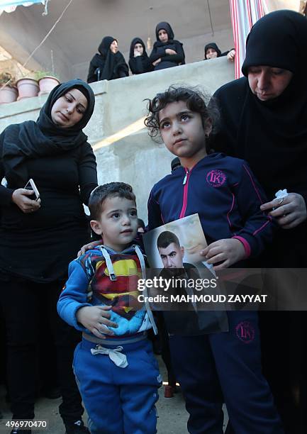 Ali and Malak , the children of Adel Termos, who was killed in a twin bombing attack that rocked a busy shopping street in the area of Burj...