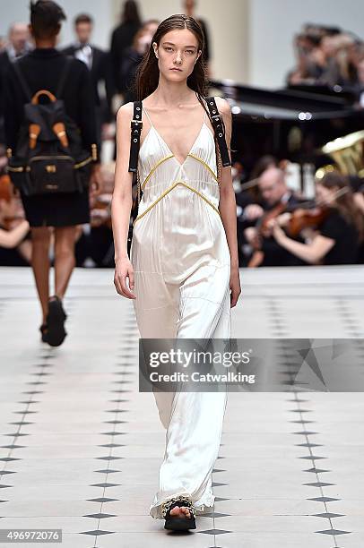 Wearing the latest slip lingerie trend, a model walks the Burberry Prorsum fashion show runway at the spring summer 2016 women's ready-to-wear...