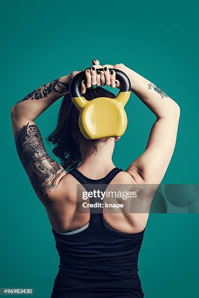 cross training woman with kettlebell training - flash back stock pictures, royalty-free photos & images