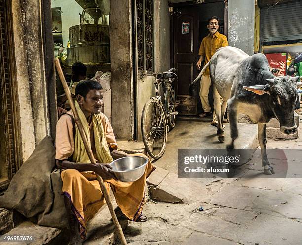 blind man begging in the street varanasi india - beggar stock pictures, royalty-free photos & images