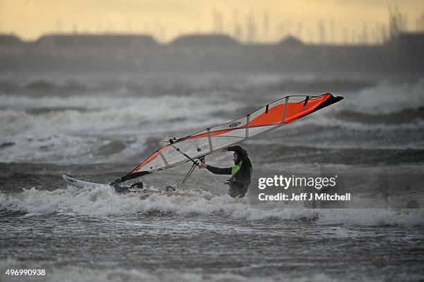 Wind surfer Douglas Paton battles with the weather at Barassie beach on November 13, 2015 in Troon, Scotland. Storm Abigail has closed schools on the...