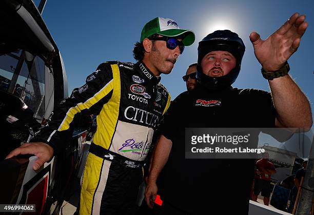 Ruben Pardo, driver of the BYB Chevrolet, prepares to drive during qualifying for the NASCAR Camping World Truck Series Lucas Oil 150 at Phoenix...