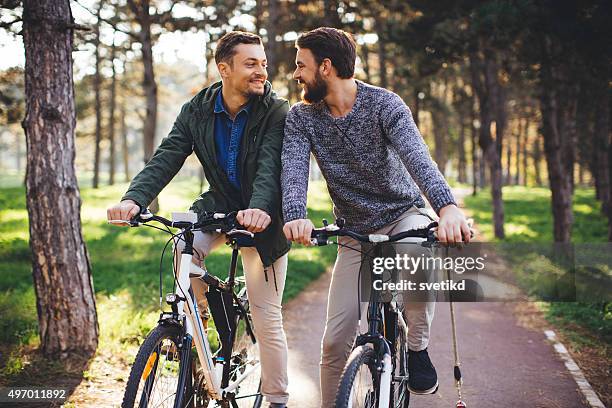 beautiful day to riding bike in nature - gay sunglasses stock pictures, royalty-free photos & images