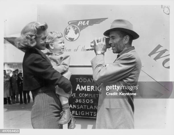 Actors and spouses Lauren Bacall and Humphrey Bogart, picking up their son Stevie from London Airport, July 21st 1951.