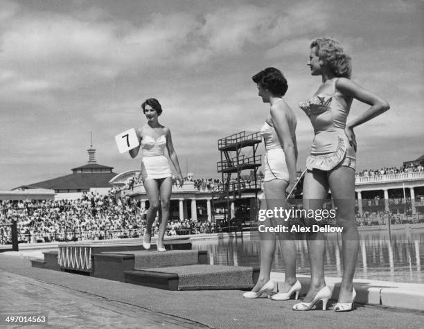 Contestants line up before the judges at a beauty competition at Butlin's holiday camp at Blackpool in Lancashire, August 1955. Original publication:...