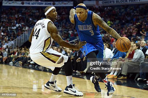 Charlie Villanueva of the Dallas Mavericks works against Dante Cunningham of the New Orleans Pelicans during a game at the Smoothie King Center on...