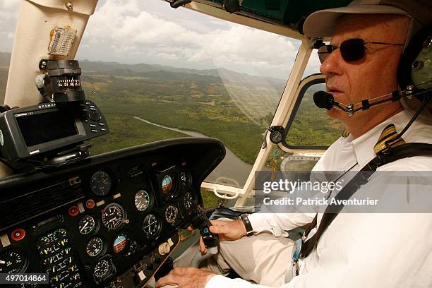 Jacques Branellec piloting a helicopter on his way to inspect one of his company's pearl farms in Palawan, 500km from Manila, where he lives. Jacques...