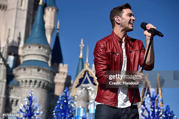 In this handout provided by Disney Parks, Andy Grammer performs during the taping of the 'Disney Parks Unforgettable Christmas Celebration' TV...