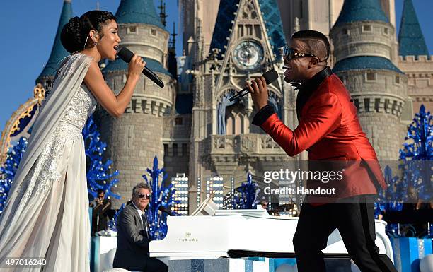 In this handout provided by Disney Parks, Jhené Aiko and Charles Perry perform with David Foster during the taping of the 'Disney Parks Unforgettable...