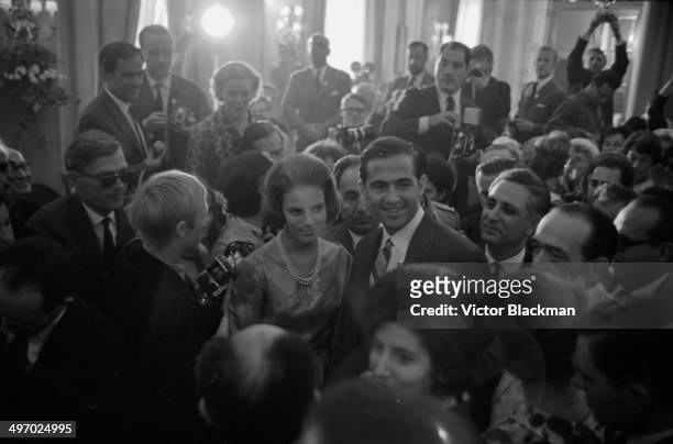 King Constantine of Greece and his wife, Princess Anne Marie of Denmark, greeted by the press, September 9th 1964.