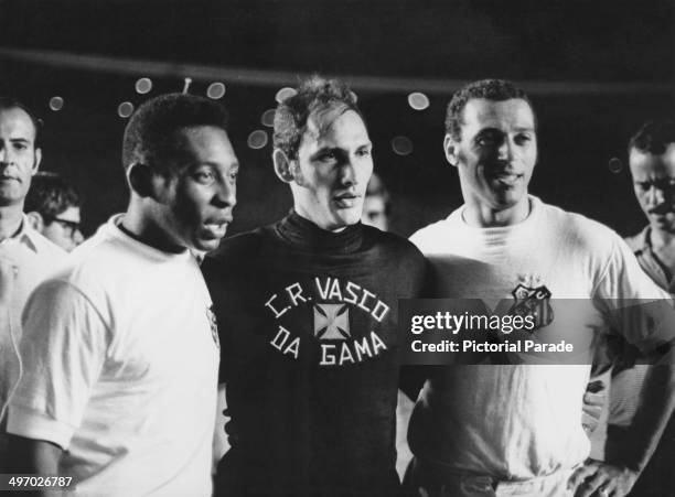 Pele pictured with Vasco de Gama goalkeeper Edgardo Andrada after the game where he scored the 1,000th goal of his career, Maracana Stadium, Rio de...