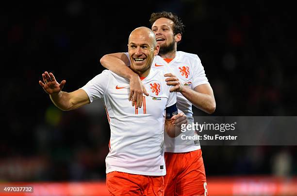 Netherlands players Arjen Robben and Daley Bind celebrate the second Dutch goal during the friendly International match between Wales and Netherlands...