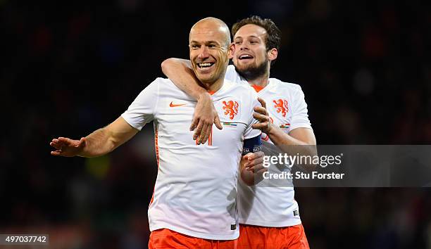 Netherlands players Arjen Robben and Daley Bind celebrate the second Dutch goal during the friendly International match between Wales and Netherlands...