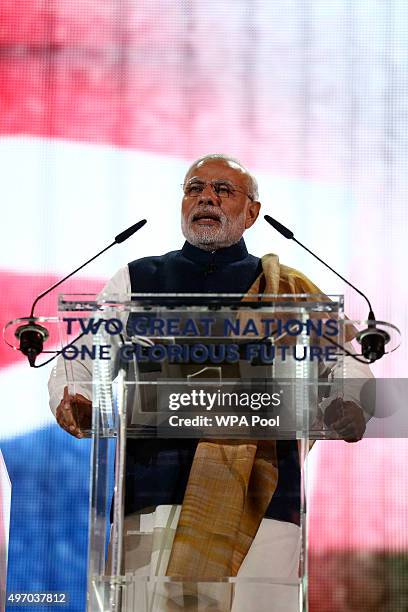 India's Prime Minister Narendra Modi speaks on stage at Wembley Stadium during a welcome rally on November 13 in London, England. In his first trip...