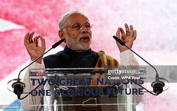 India's Prime Minister Narendra Modi speaks on stage at Wembley Stadium during a welcome rally on November 13 in London, England. In his first trip...