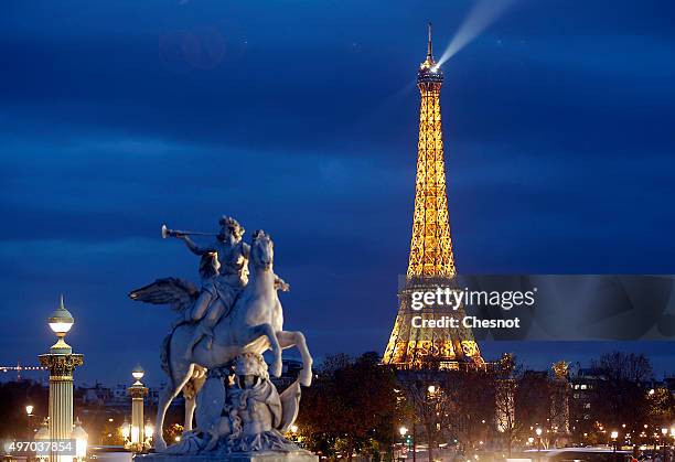 Picture shows the Eiffel Tower by night on November 13, 2015 in Paris, France. Paris will host the World Climate Change Conference 2015 from November...