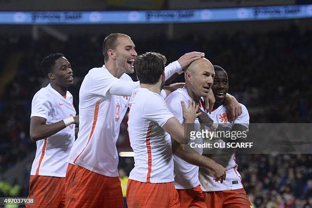 Netherlands' players celebrates after Netherlands' midfielder Arjen Robben scored their second goal during the international friendly football match...