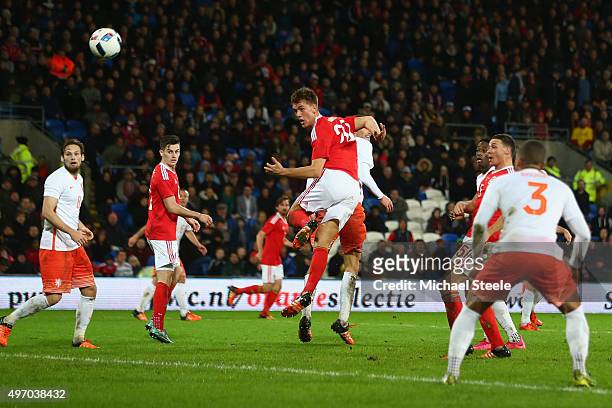 Emyr Huws of Wales heads his sides second goal during the international friendly match between Wales and Netherlands at Cardiff City Stadium on...