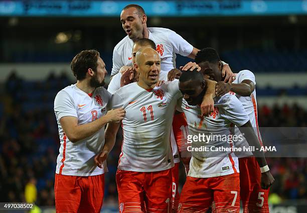 Arjen Robben of Netherlands celebrates after he scores a goal to make it 1-2 during the International Friendly match between Wales and Netherlands at...