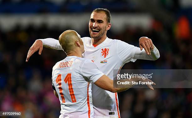 Netherlands scorer Arjen Robben celebrates the third Dutch goal with Bas Dost during the friendly International match between Wales and Netherlands...